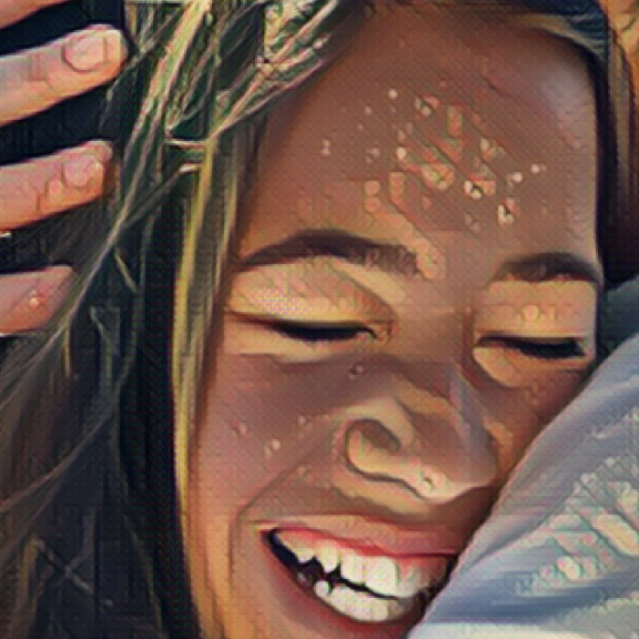 A close up of a young person's smiling face. They appear to be embraced in a hug