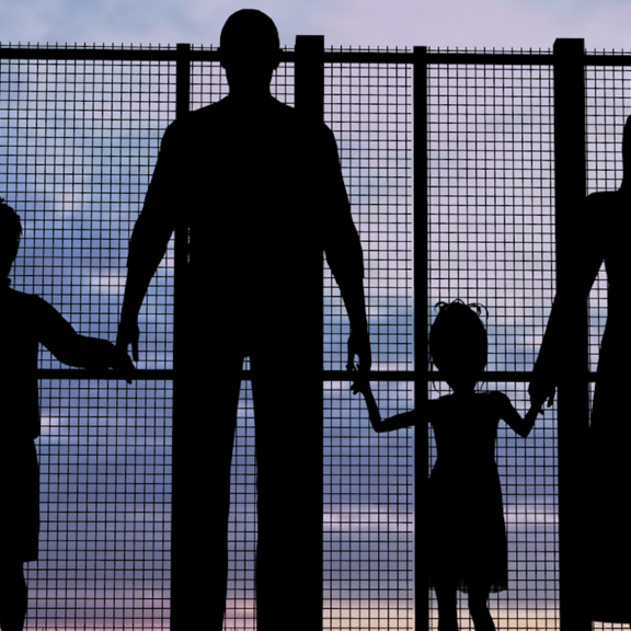 family at border wall